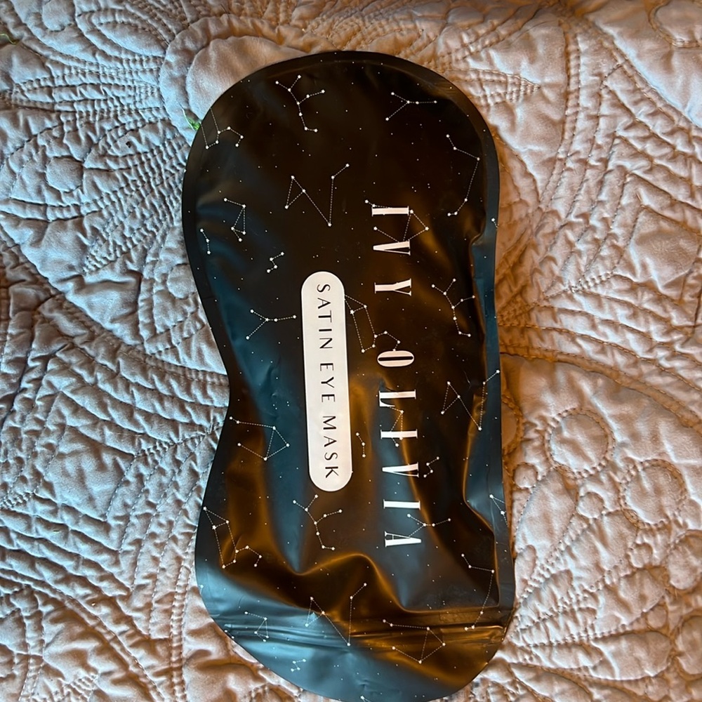 Satin eye mask. Never opened.